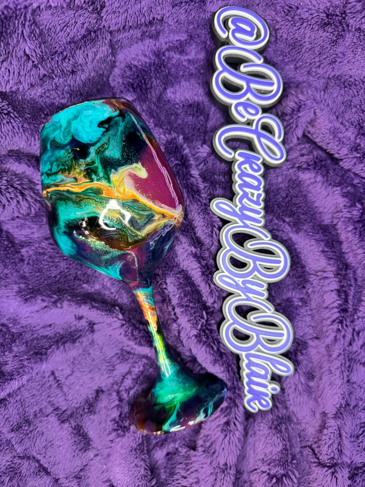 8.  Burgundy and teal Wine glass